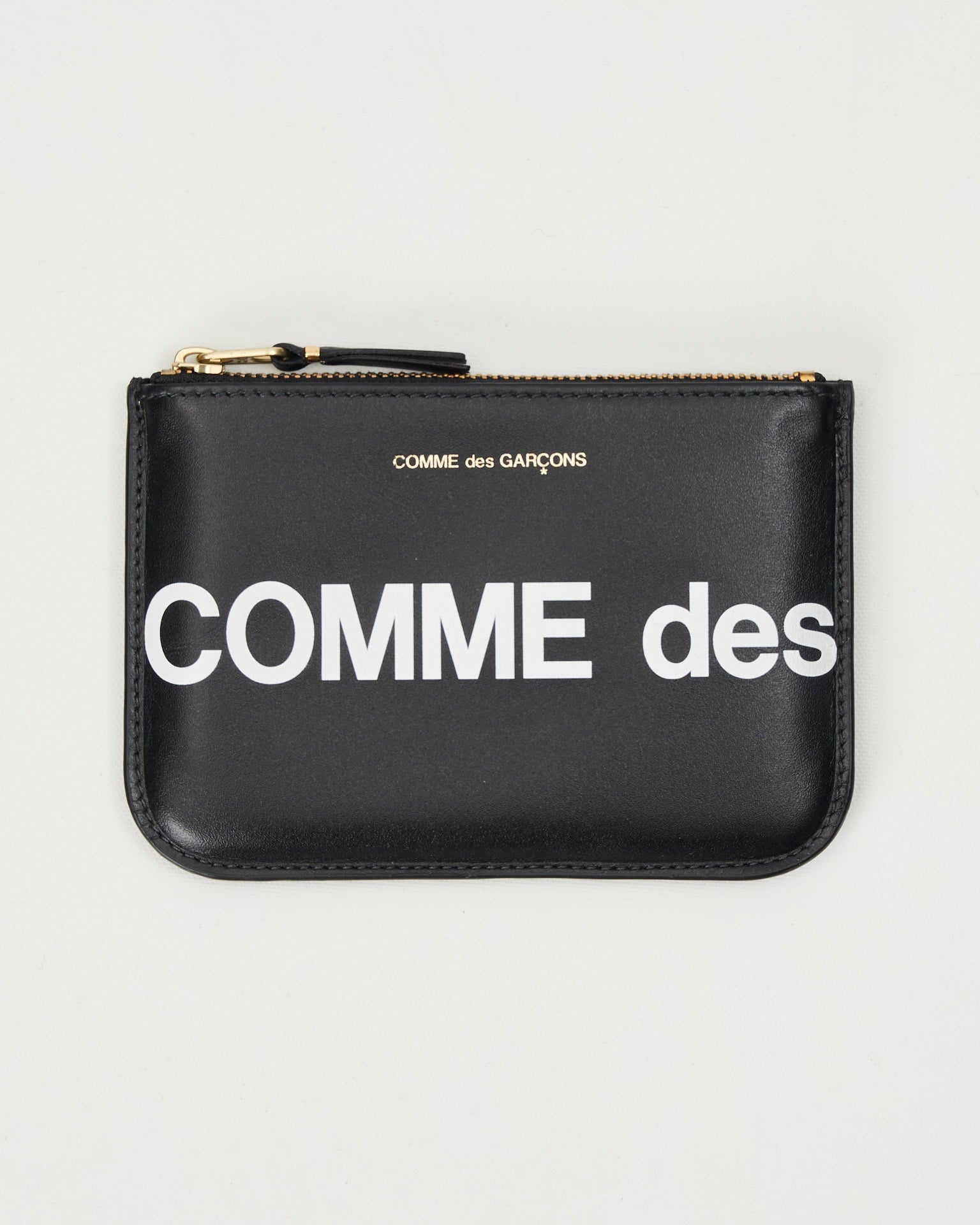 Comme des Garçons bustina nera maxilogo e micrologo frontale