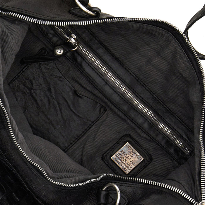 Campomaggi multi-pocket bag with studs and twist lock closure