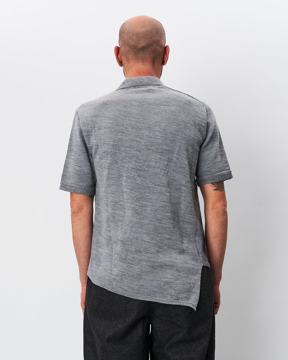 Comme des Garçons polo grigia asimmetrica in lana